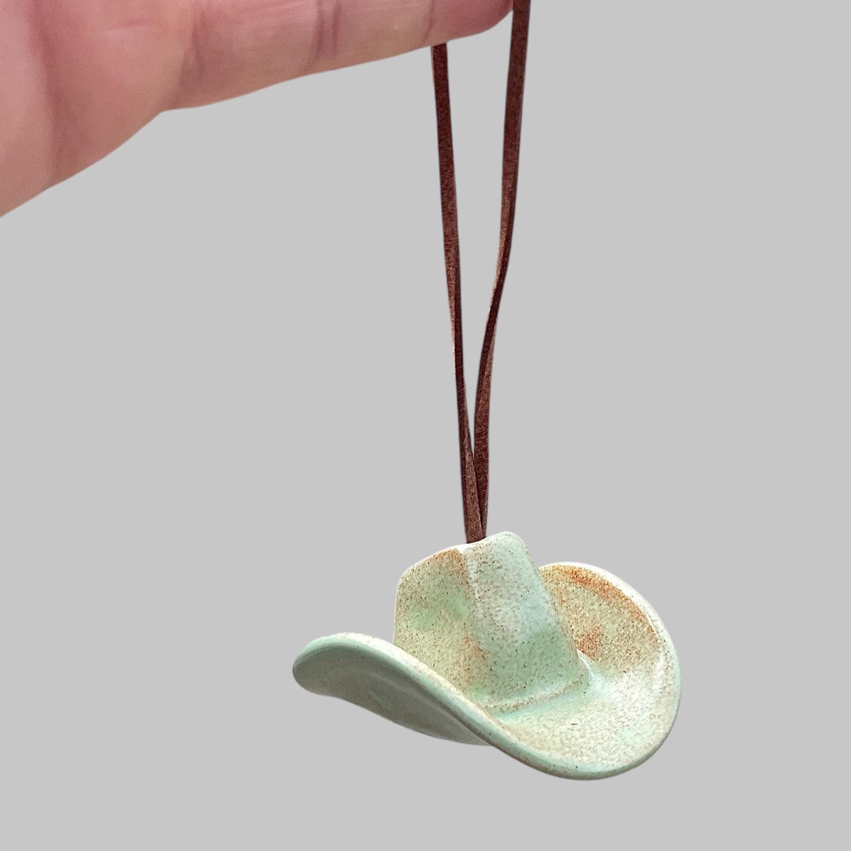 Small Ceramic Cowboy Hat Ornament with Vegan Leather Cord — Sage Green Glaze