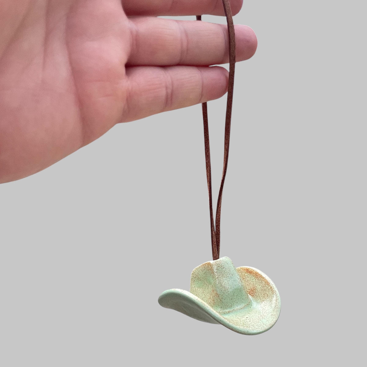 Small Ceramic Cowboy Hat Ornament with Vegan Leather Cord — Sage Green Glaze